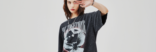 Young model wearing dark Korean streetwear shirt with eagle graphic design